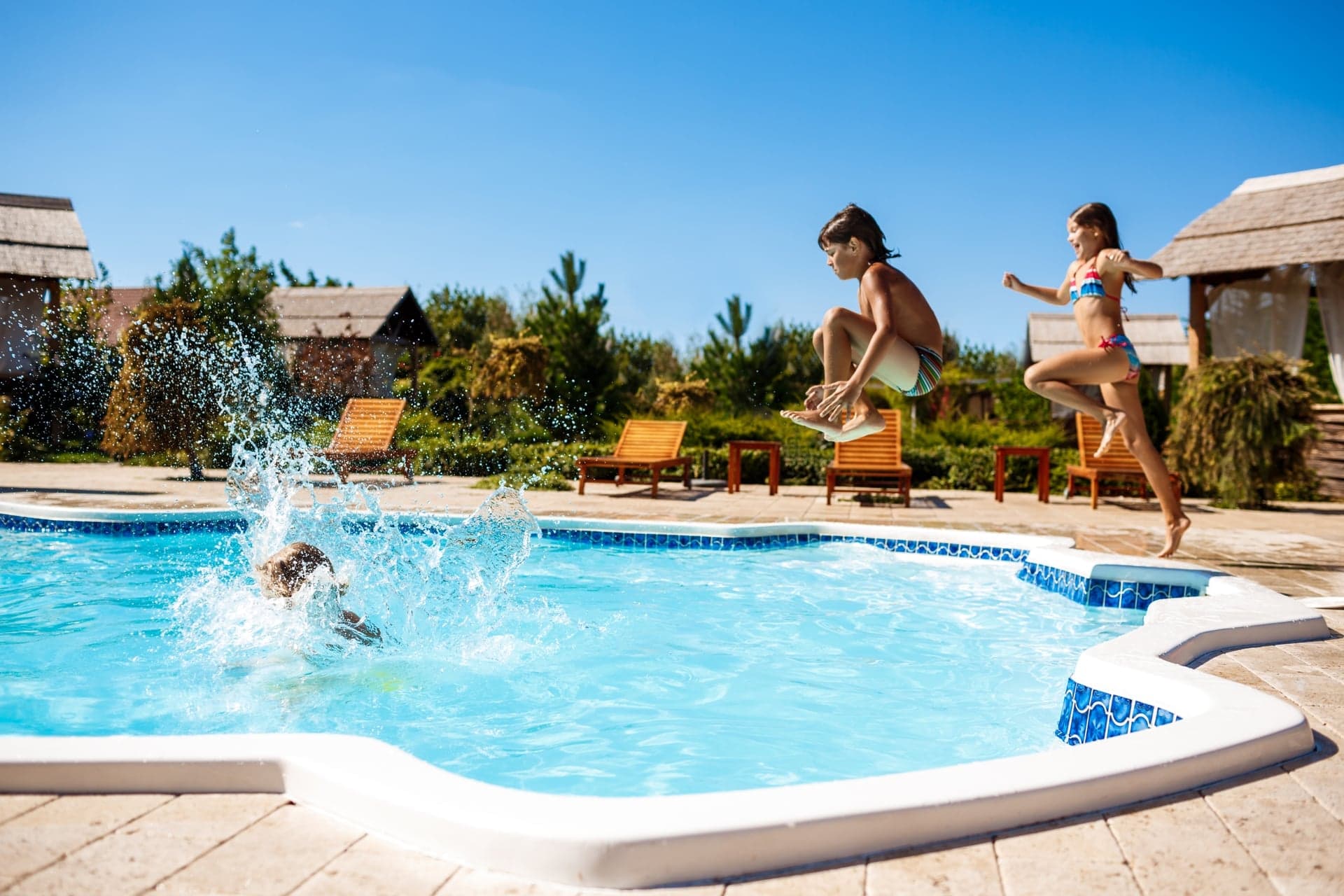 Family enjoying fiberglass pool in Florida
