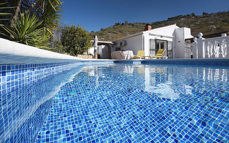 Luxury Florida pool renovated with a reinforced PVC membrane and deep blue water