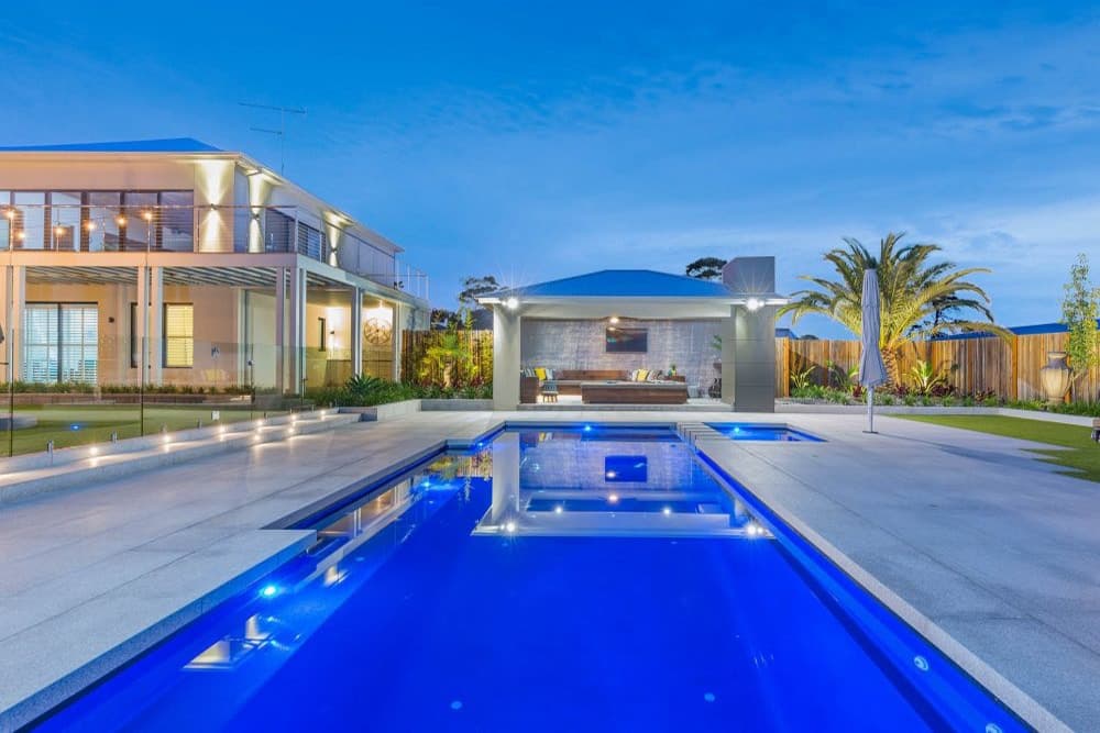 Beautiful Tuscan fiberglass pool installation in Port St. Lucie Florida backyard - Professional pool installation by Cool Pool of Florida licensed contractors serving St. Lucie County