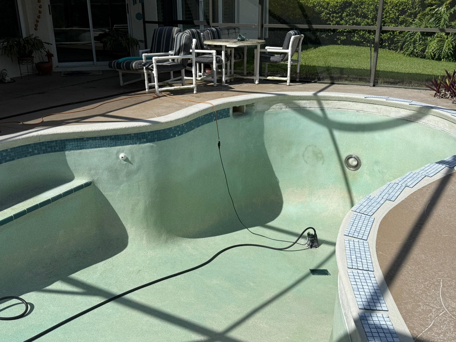 Stunning finished pool with complete mosaic tile waterline installation