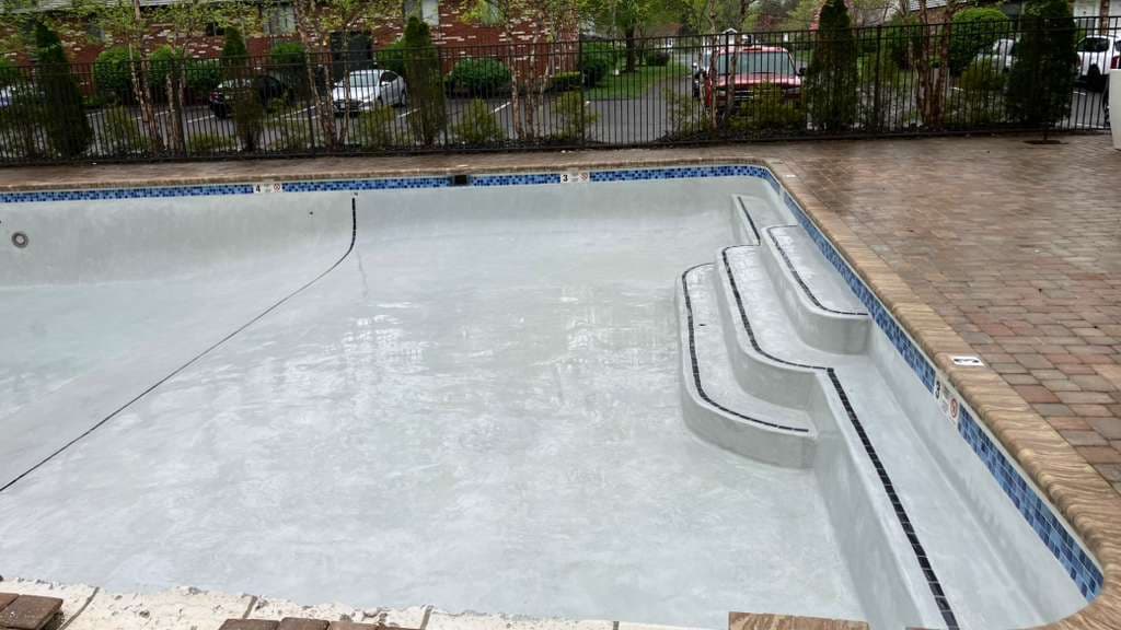 Pool after resurfacing - beautiful improved concrete finish with perfect steps and edges