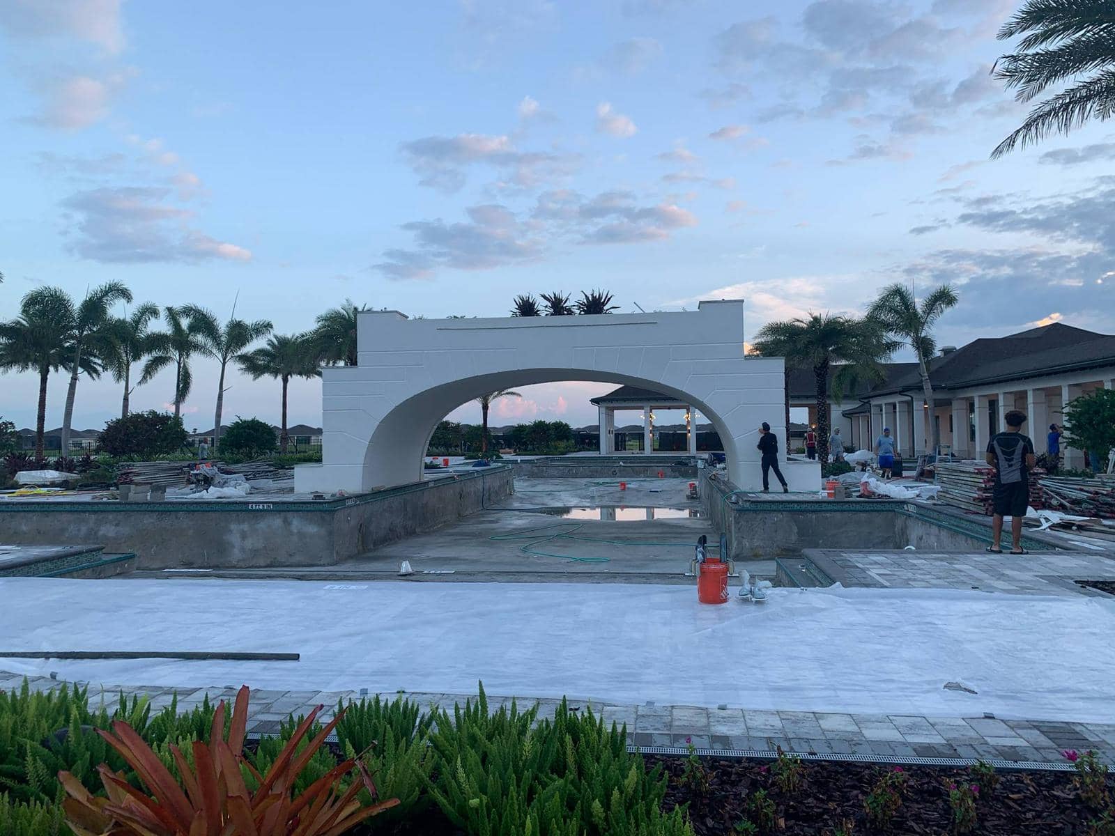 Commercial pool before resurfacing - large scale pool complex with architectural features needing professional restoration