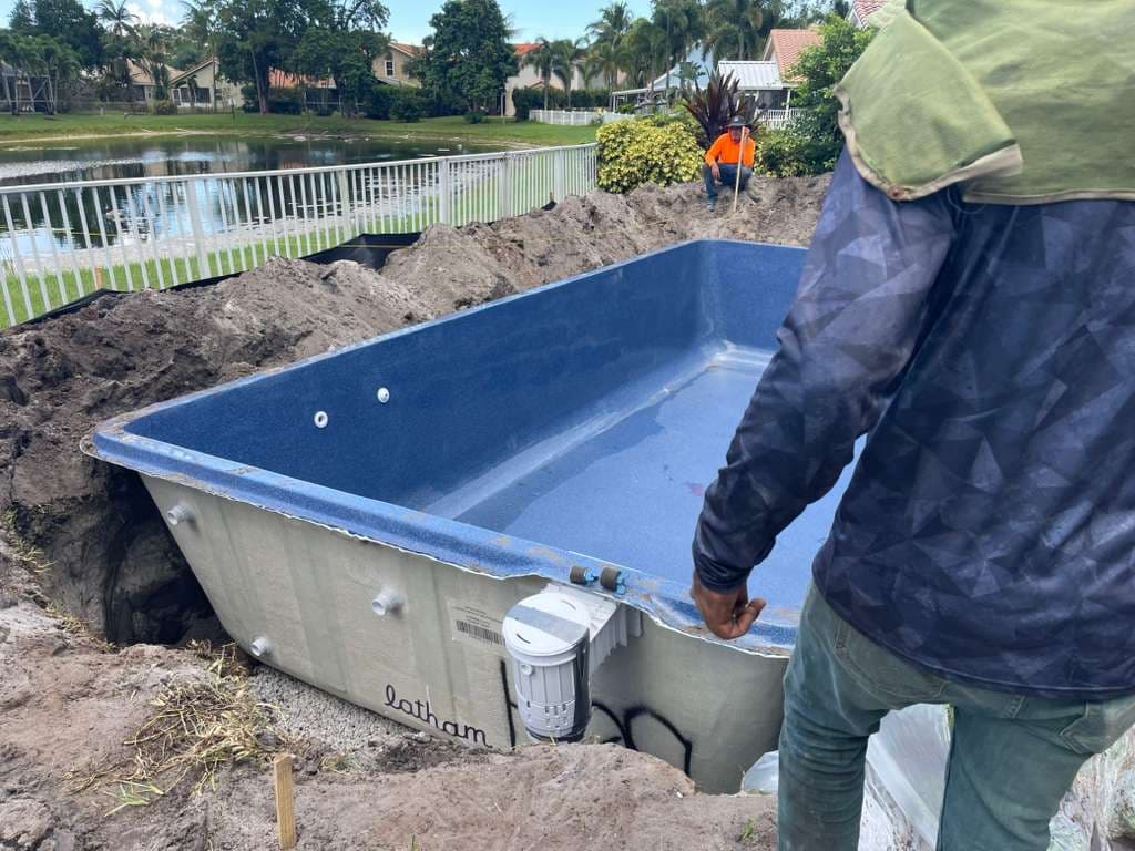Latham Delray fiberglass pool shell in Sapphire Blue set in the ground by Cool Pool of Florida in West Palm Beach FL