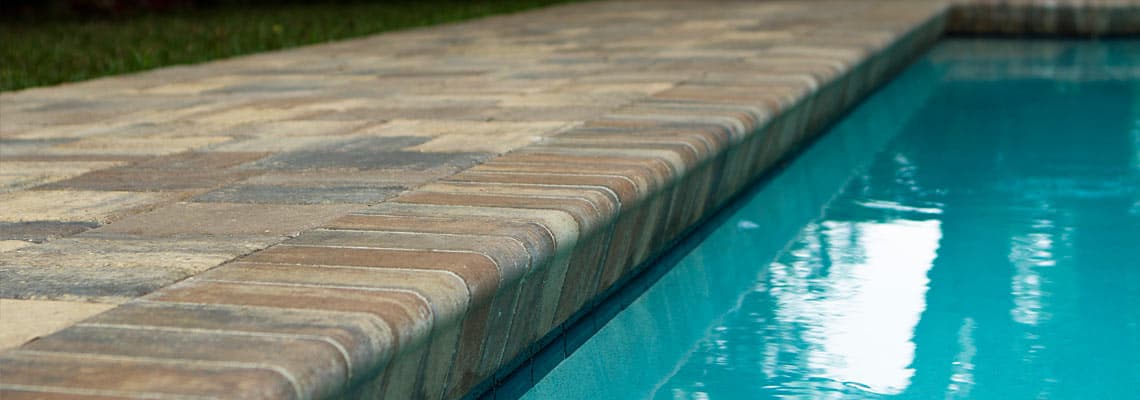 Tremron pavers and bullnose coping installed on pool deck