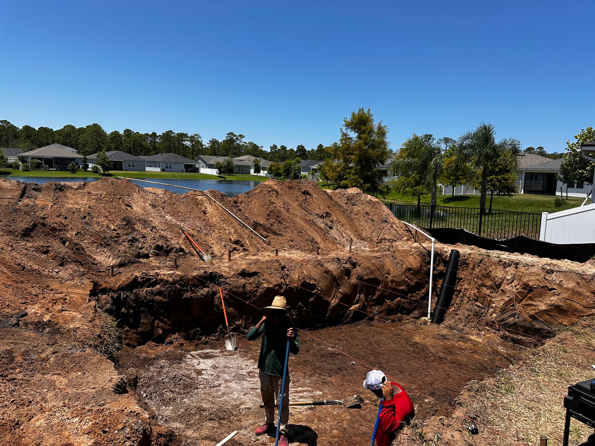 Site Layout & Excavation - Professional fiberglass pool installation Day 1 process in Florida by certified Latham pool installers using crane equipment