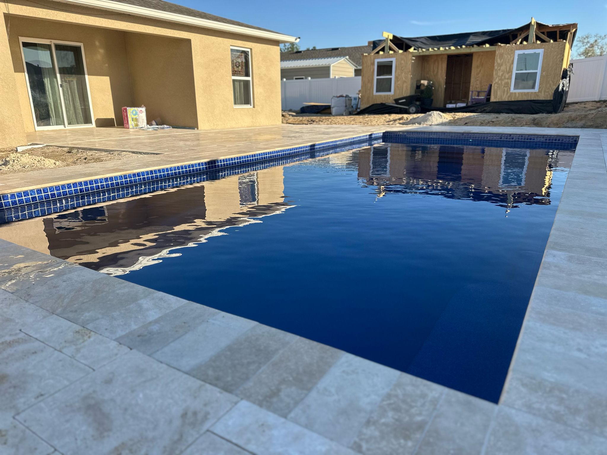 Startup & Final Details - Professional fiberglass pool installation Day 11-14 process in Florida by certified Latham pool installers using crane equipment
